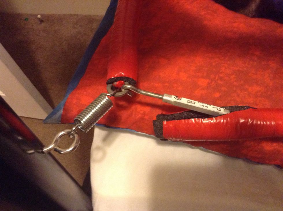Once the rope is all the way around tape it to one end of a turnbuckle & hook the other end as shown. This allows tightening of the ropes and makes it easier to take down the front ropes if wanted.