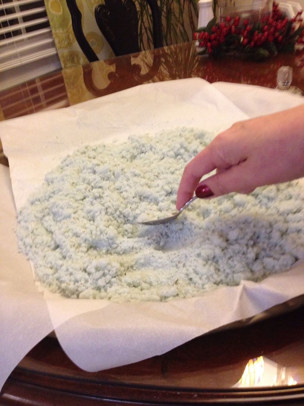 Once the salt mixture has dried, take the back of a spoon and crush the salts until smooth. Make sure to crush any large clumps that may have formed during the drying process.
