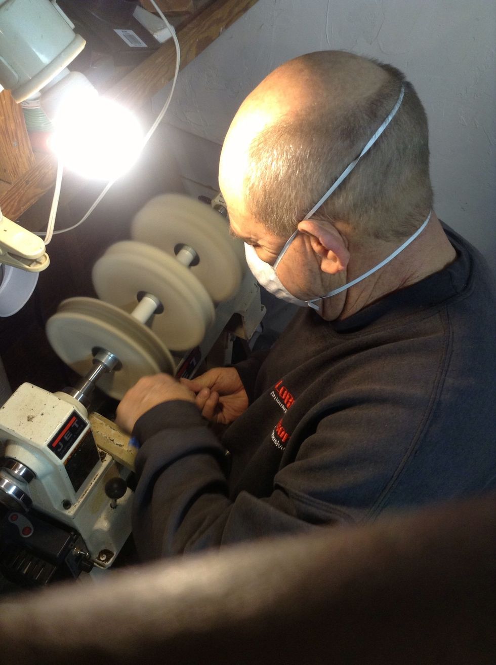 Once the sanding has been done, buff out the handle. Ain't nobody has time for safety goggles.