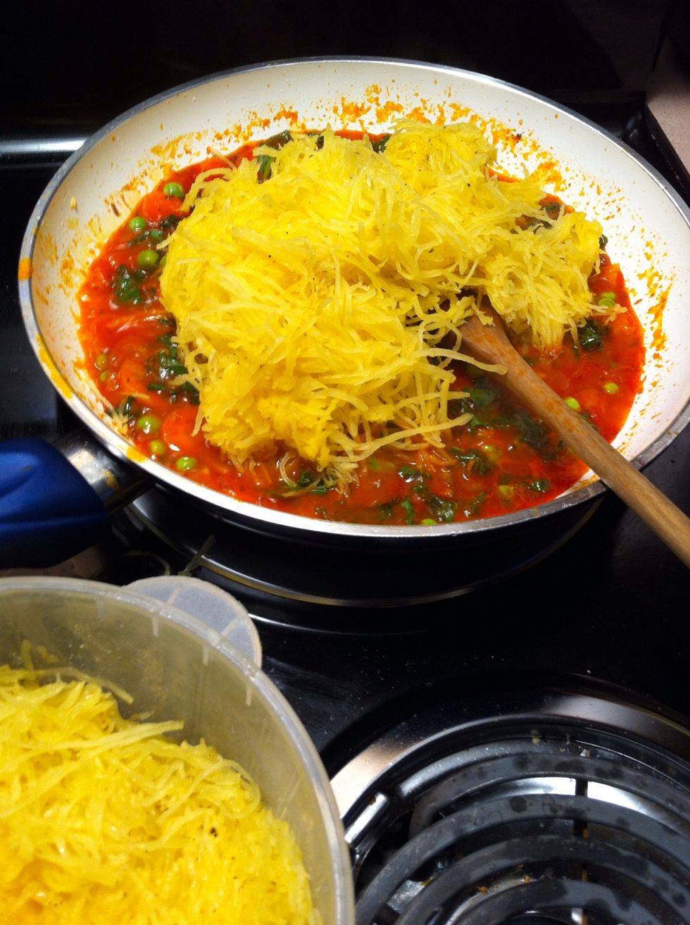 Once the sauce has thickened and reduced in volume, add your squash and mix it in. I make the squash ahead of time so I added it cold but it's not nencessary. At this point you can add more tom juice.