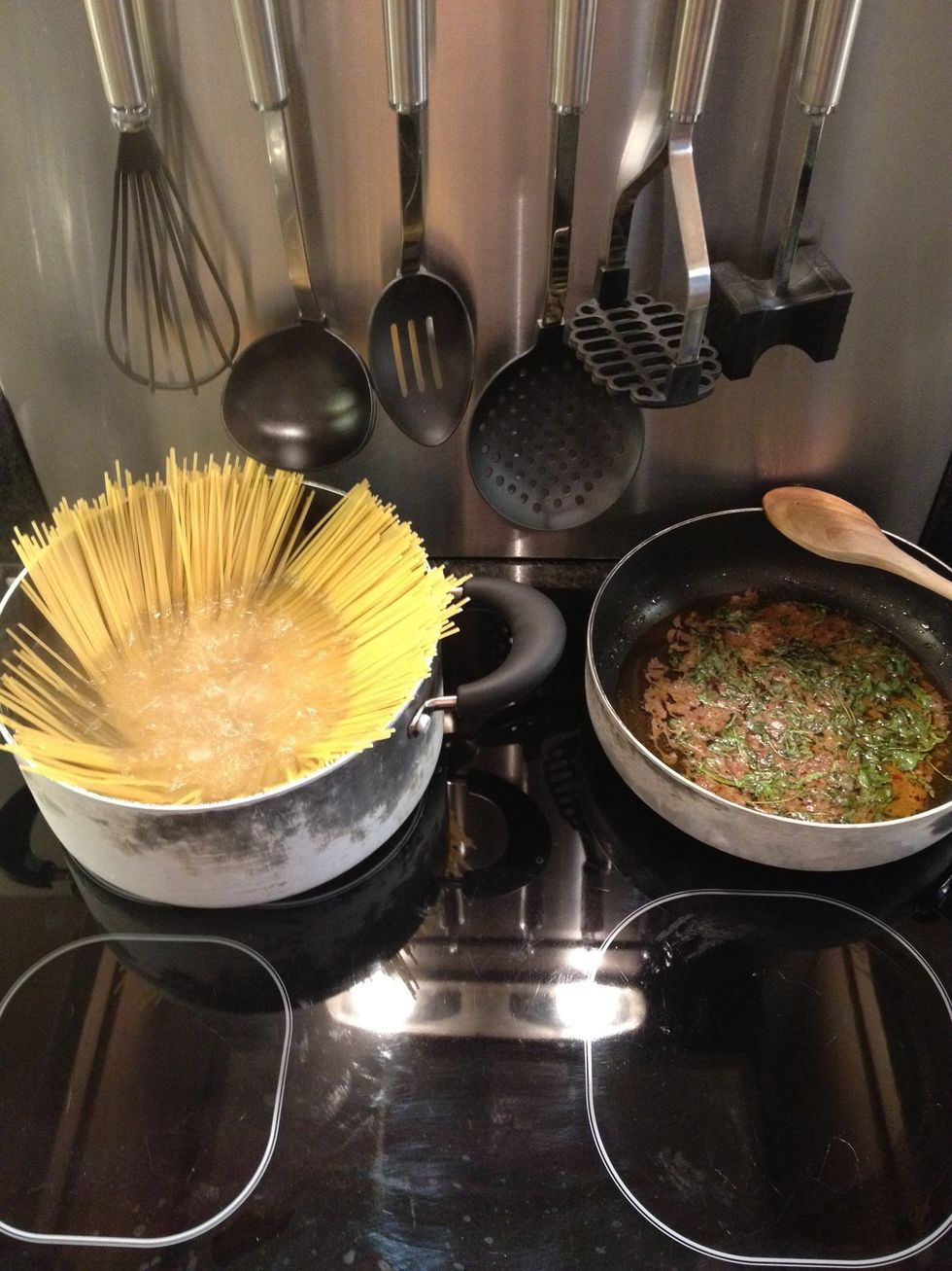Once the sauce is off the heat, chuck the spaghetti into salted boiling water and cook according to the instructions on the packet. A few mins before its ready, put the sauce back on the heat to warm.