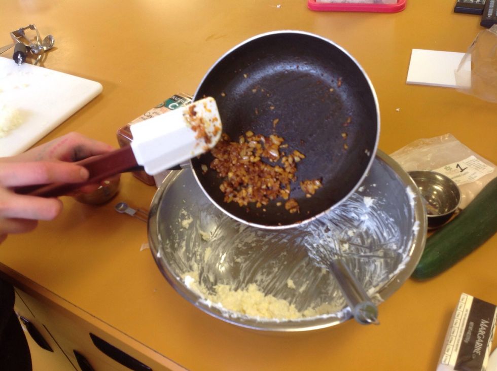 Once the spices are mixed in add the entire mixture to the bowl of whipped feta and cream cheese.