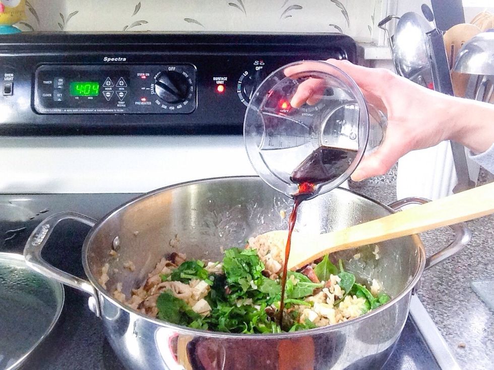 Once the spinach has wilted, whisk together the rice vinegar, soy sauce and sesame oil in a separate container and then add to the pot. Stir in gently.