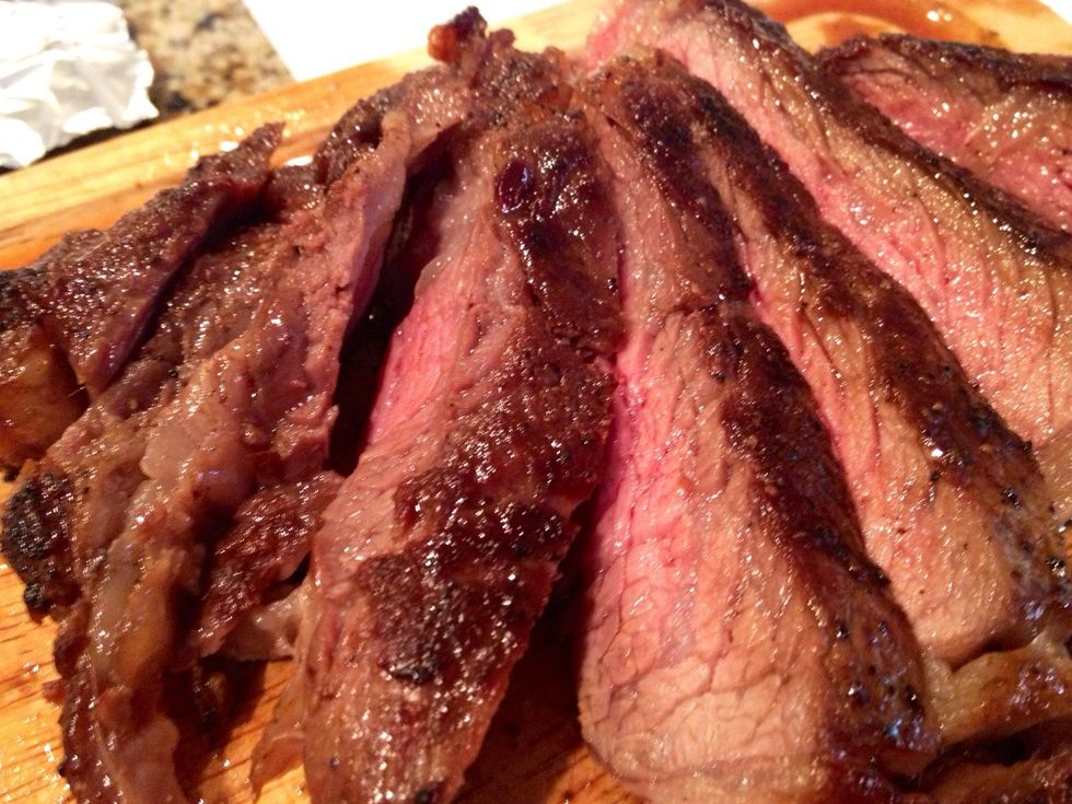 Once the Steak is cooled, cut the Steak into slices and plate. (We like our Steak cooked to medium rare!) This will be by far one of the simplest, easiest, and tastiest Steak you will ever have!