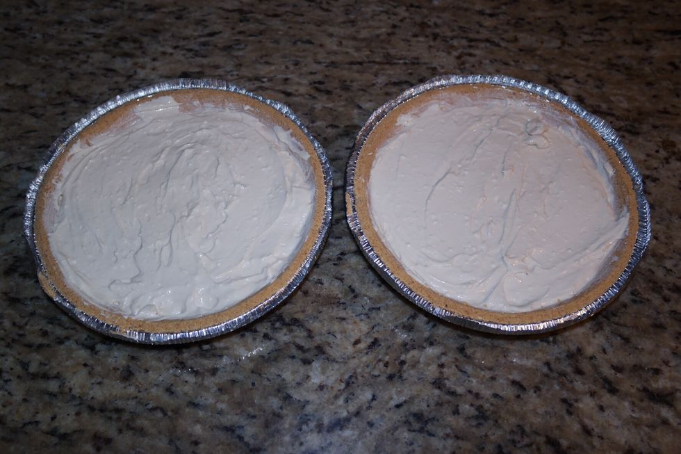 Once the ten minutes are done, let it cool for 5 min. Once the 5 min are done, start to put in the mix evenly onto each cookie plate. Make sure both are distributed evenly.