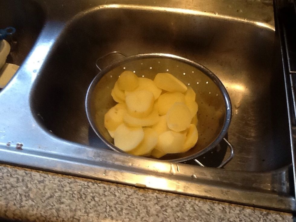 Once the ten minutes are up, strain the potatoes over a sink.