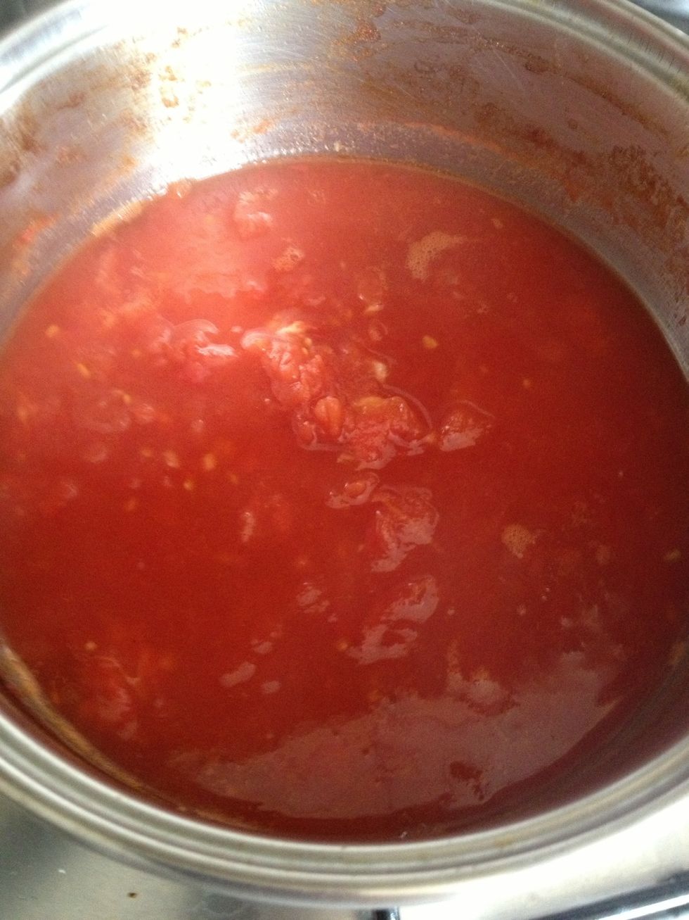 Once the tomato mix has reduced about half way ( you can see the line of the original sauce on the pan), turn the heat down.