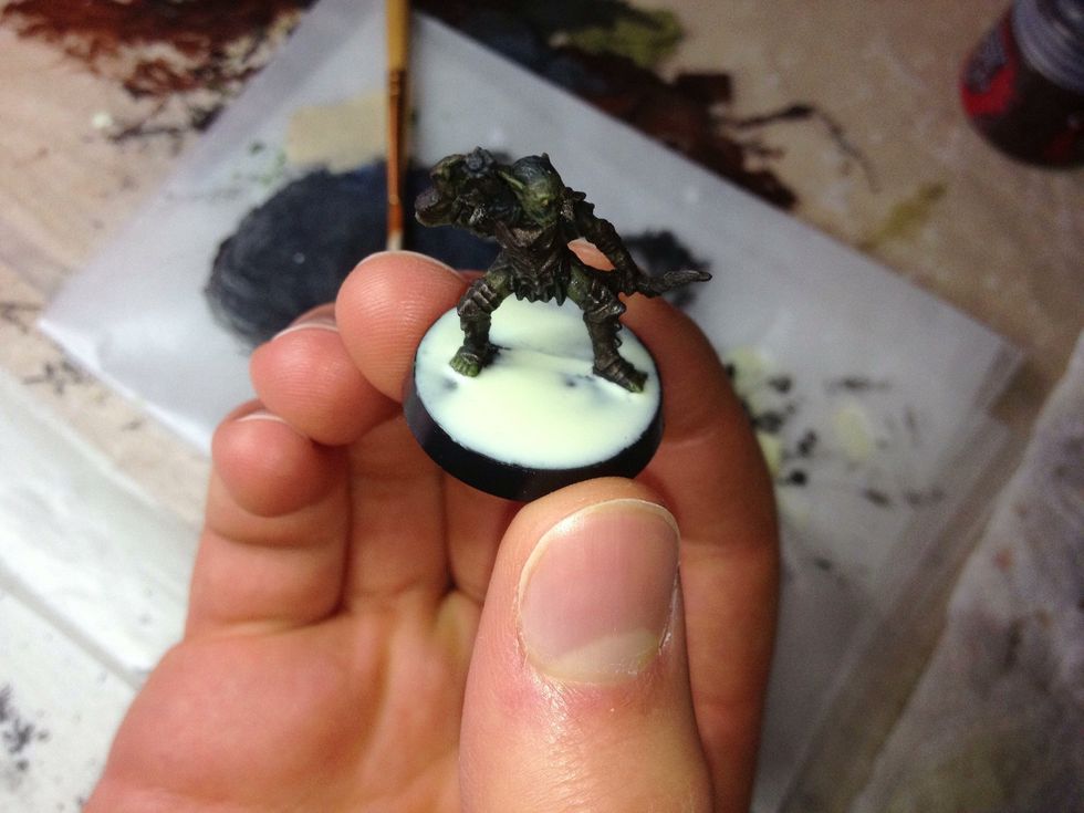 Once the top of the base is completely covered with wood glue, you're ready to add the sand.