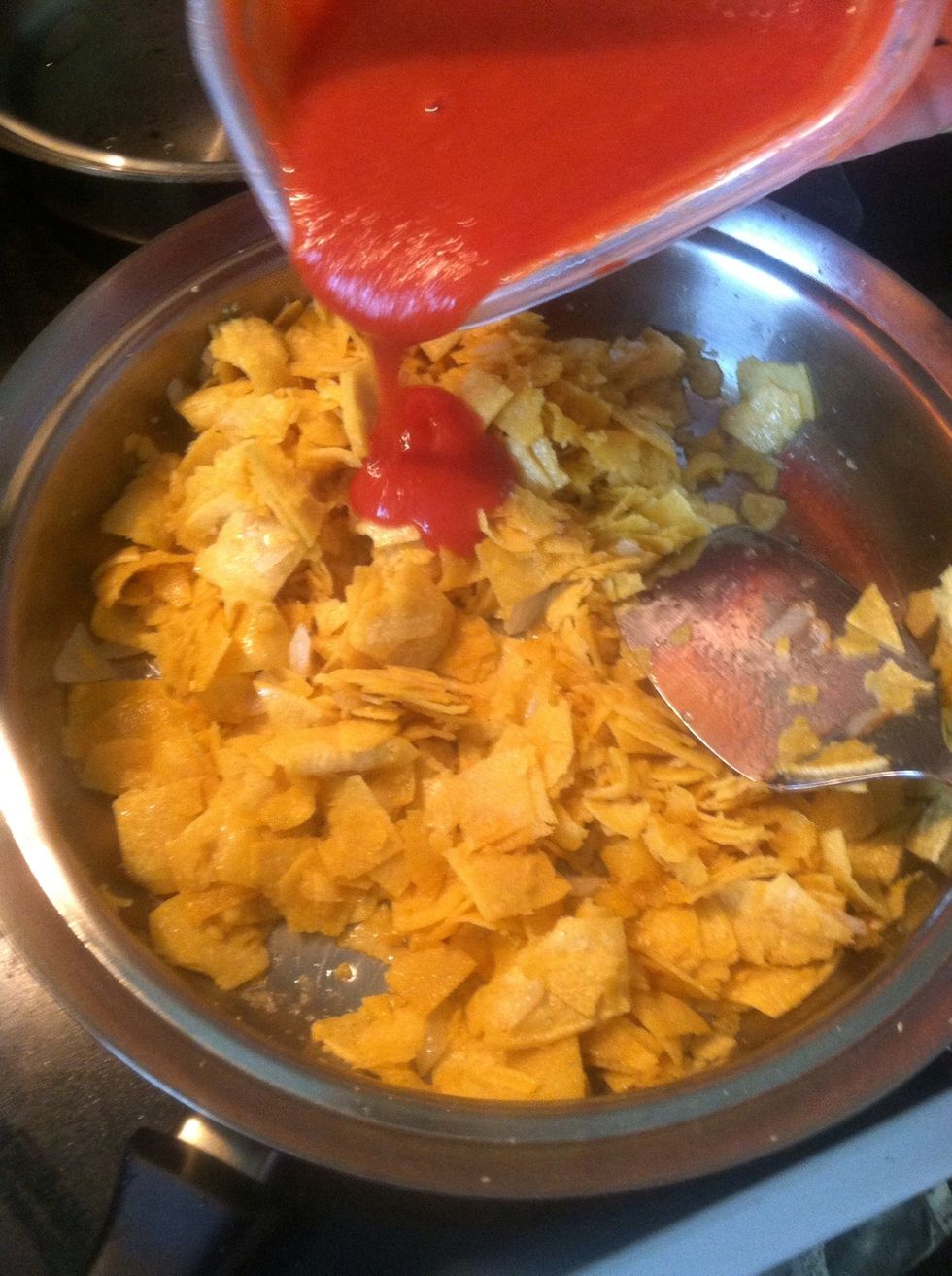 Once the tortillas start to get a little soggy add the tomato.