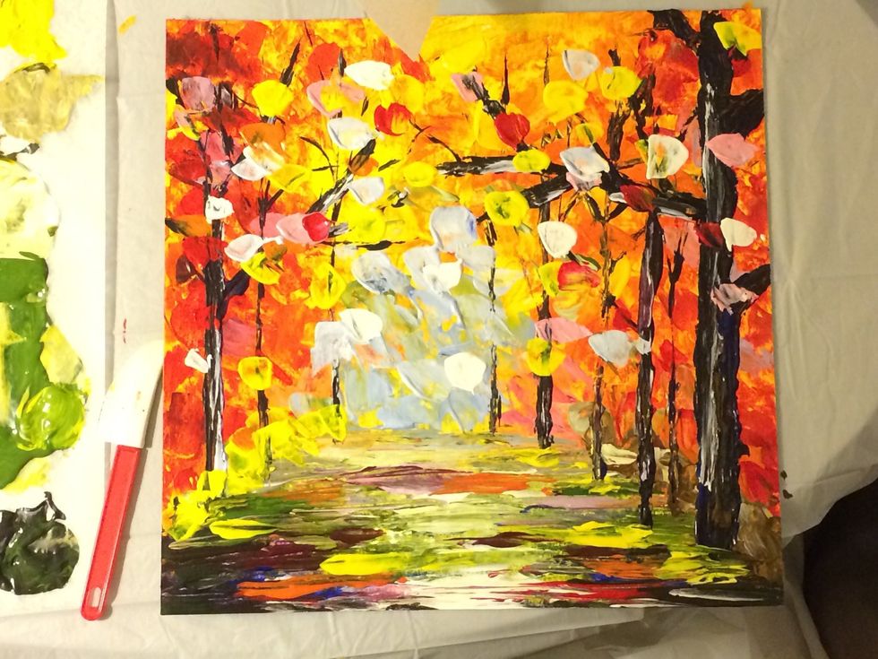 Once the trees are complete. Place more dabs of yellow, red, orange , pink and white on top.