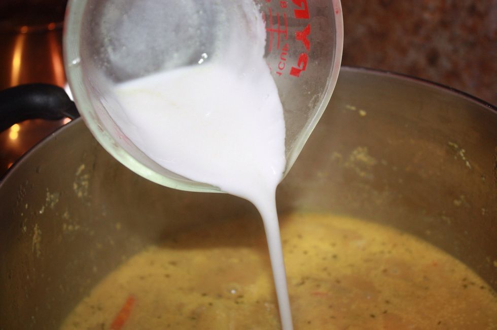 Once the vegetables are almost done, pour in the remaining 1/2 cup of coconut milk