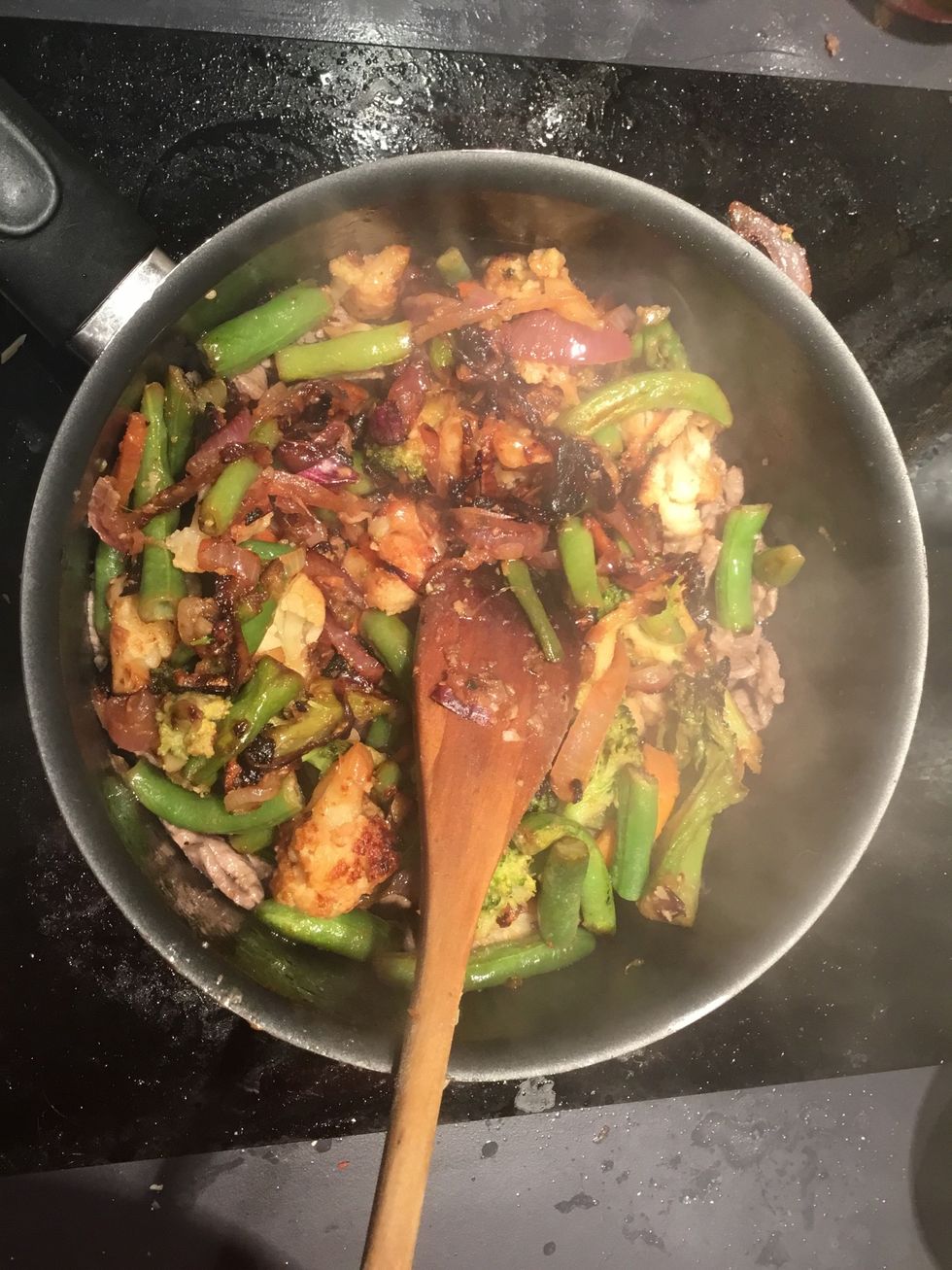Once the veggies are brown and  caramelised, add to the beef