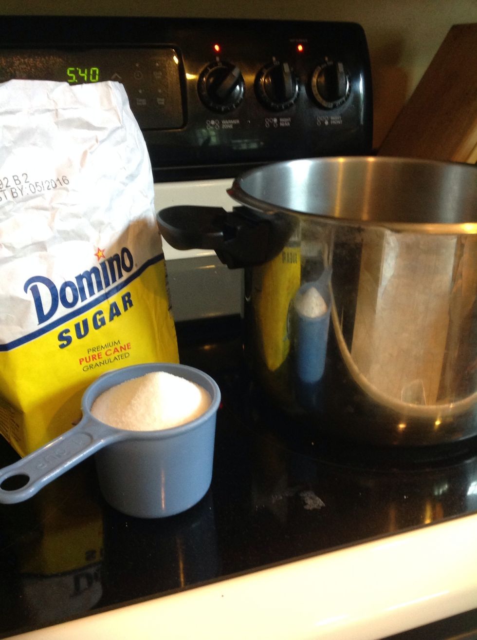 Once the water has boiled and the tea bags are added, pour in about a cup of sugar and stir until dissolved.  At this point, the tea must come to room temperature. Tea bags can be discarded.