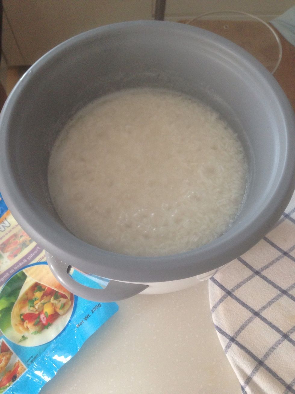 Once the water is at the same level as the rice, it should be ready for straining