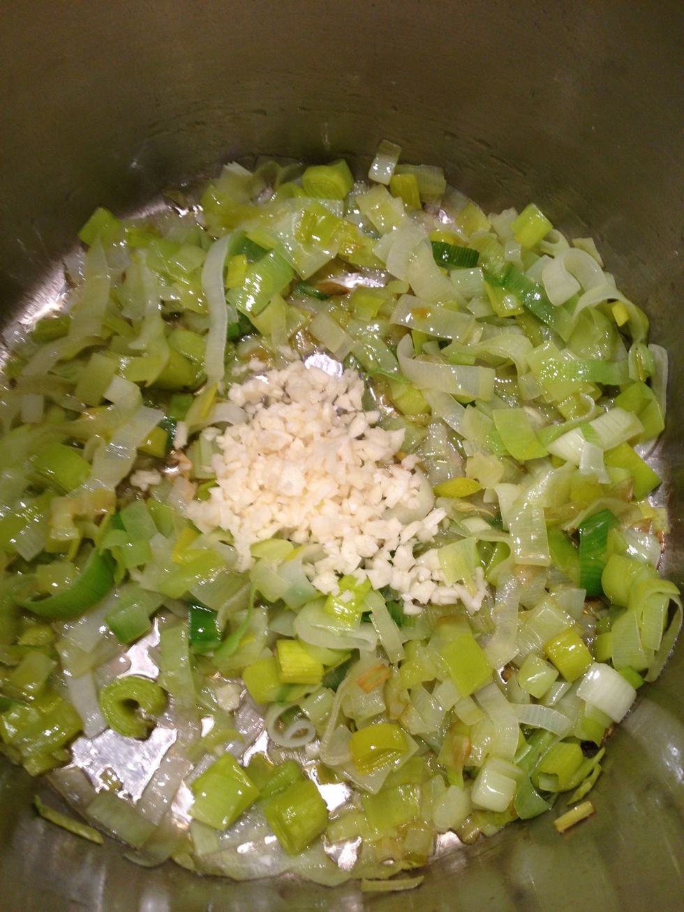 Once the whites of the leeks start looking transparent add your garlic and continue to cook for about another minute or two.