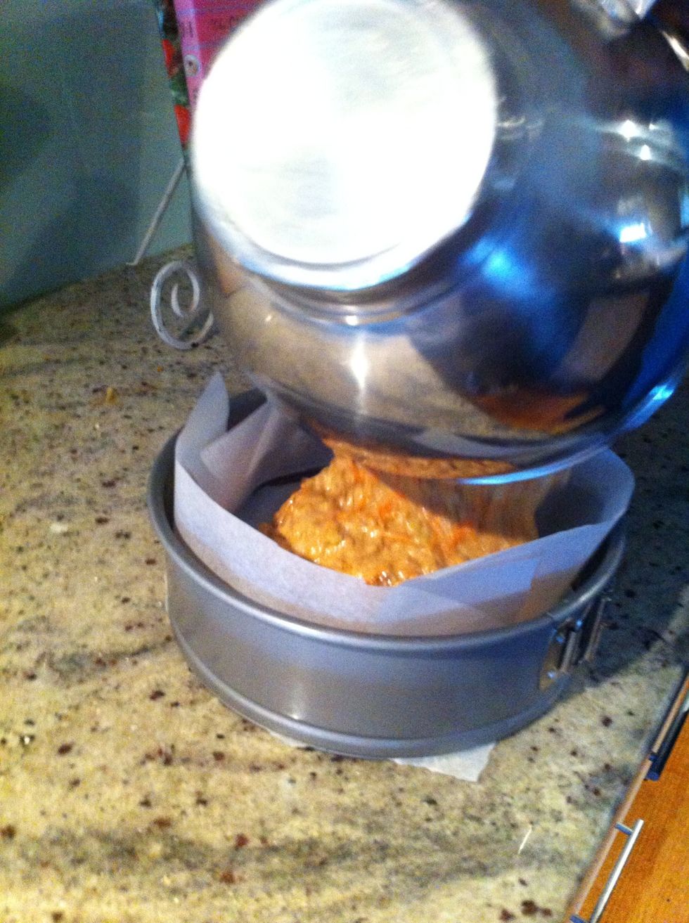 Once the whole mixture is blended in, pour the mixture into a 22cm round cake tin lined with baking paper