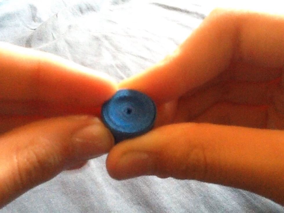 Once the whole strip is curled hold it in place for about ten seconds so the shape holds.