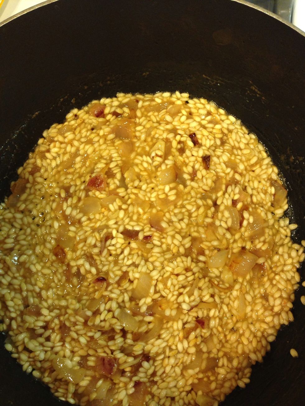 Once the wine has been absorbed most of the way, you're ready to start adding broth.