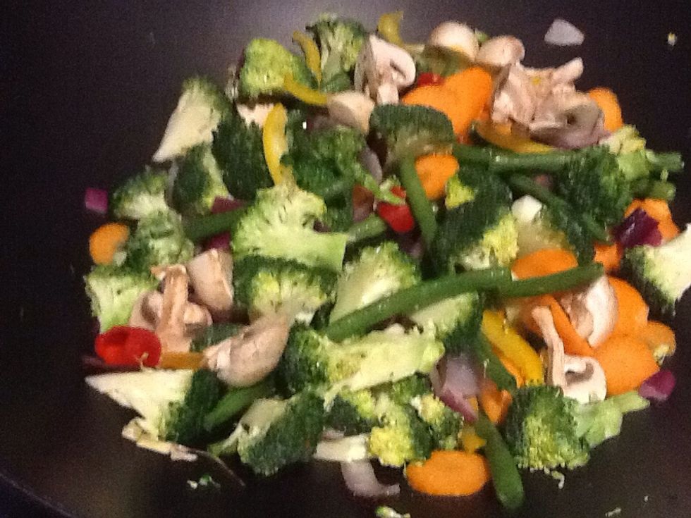 Once the woody vegetables are added stir them around so they can be dressed in a nice coat of oil