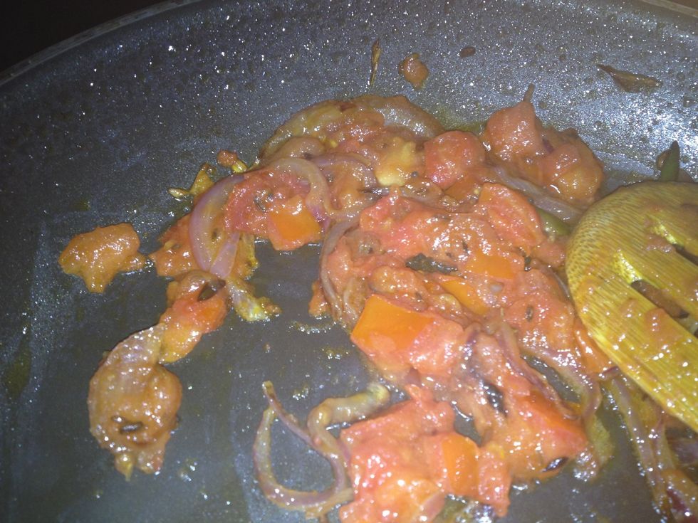 Once they are all mashed up like this add already cooked rice and stir it well