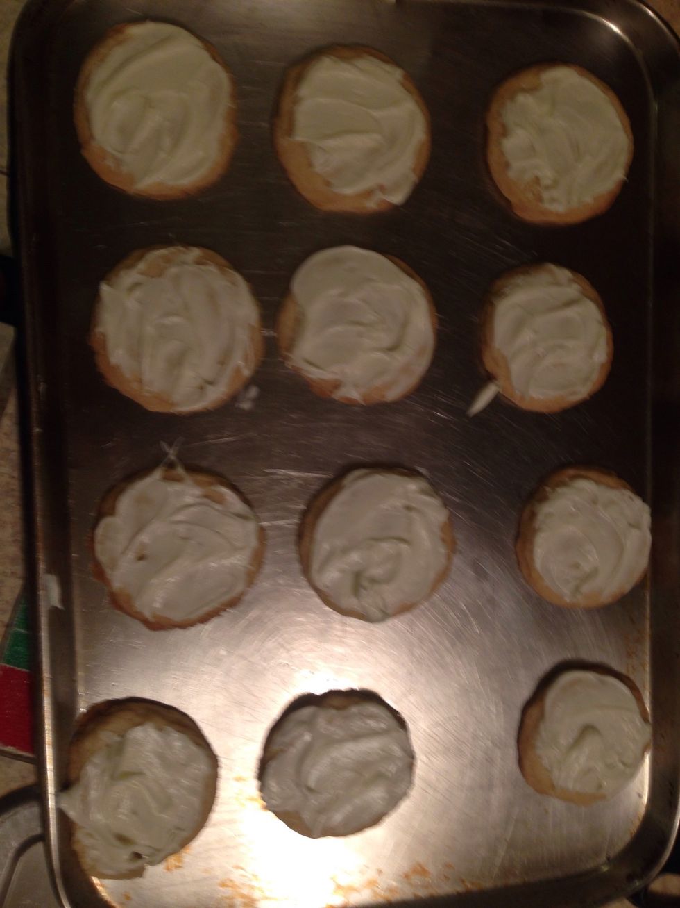 Once they are cool frost the cookies with the vanilla frosting