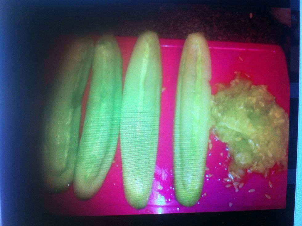 Once they have been peeled, cut them down the middle and scoop out seeds using a spoon.