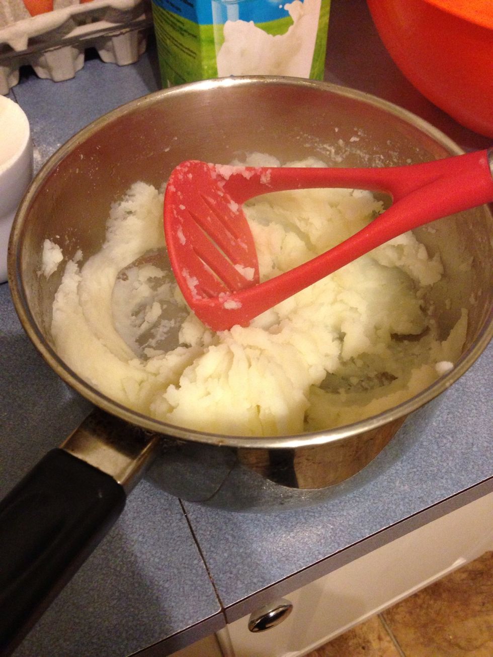 Once they're cooked, strain and mash them.