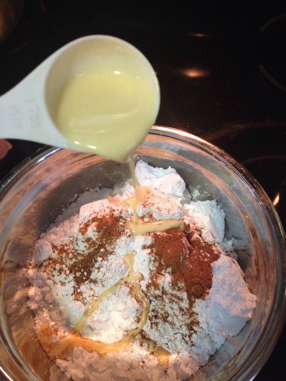 Once they've cooled completely, mix the other 2 tbsps of eggnog, the nutmeg (adjusted for taste) and powdered sugar together. It will be thick, but this will allow the icing to set up quickly.