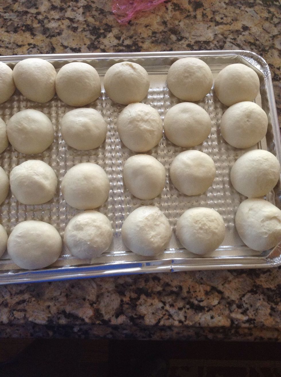 Once they've raised to nearly touching, get your pepperoni ready to stuff the rolls