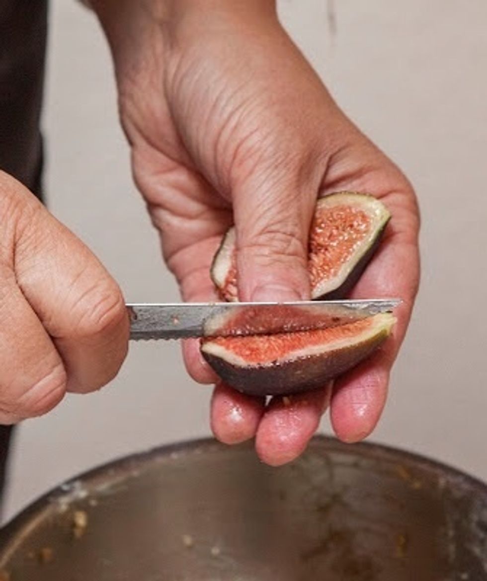 Once this has been spread on the bottom of the crust, quarter the clean fresh figs.