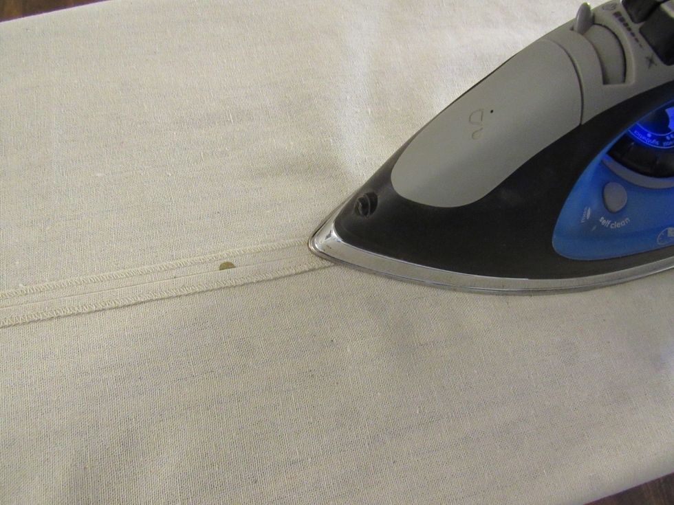 Once to sides are sewn together, open the entire piece and press down the middle seam to flatten.