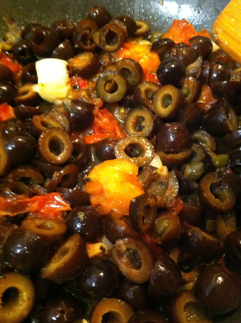 Once tomato begins to get saucy (oh, you saucy tomato, you!) add in chopped black olives