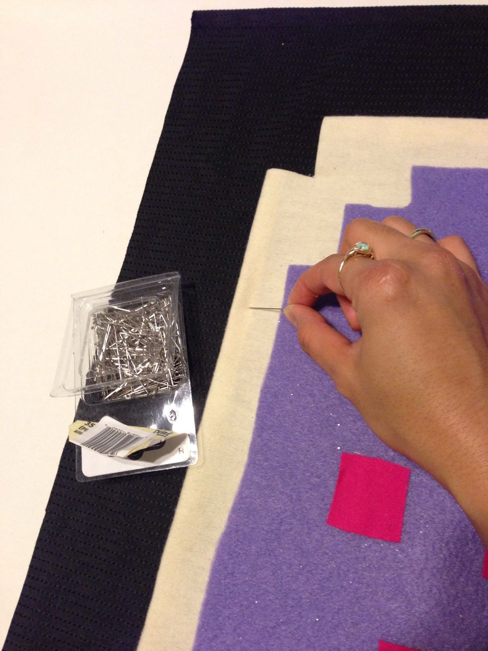 Once u have it to where u want, cut the black fabric and start pinning down ur poptart. This way when we sew it on, it won't move.