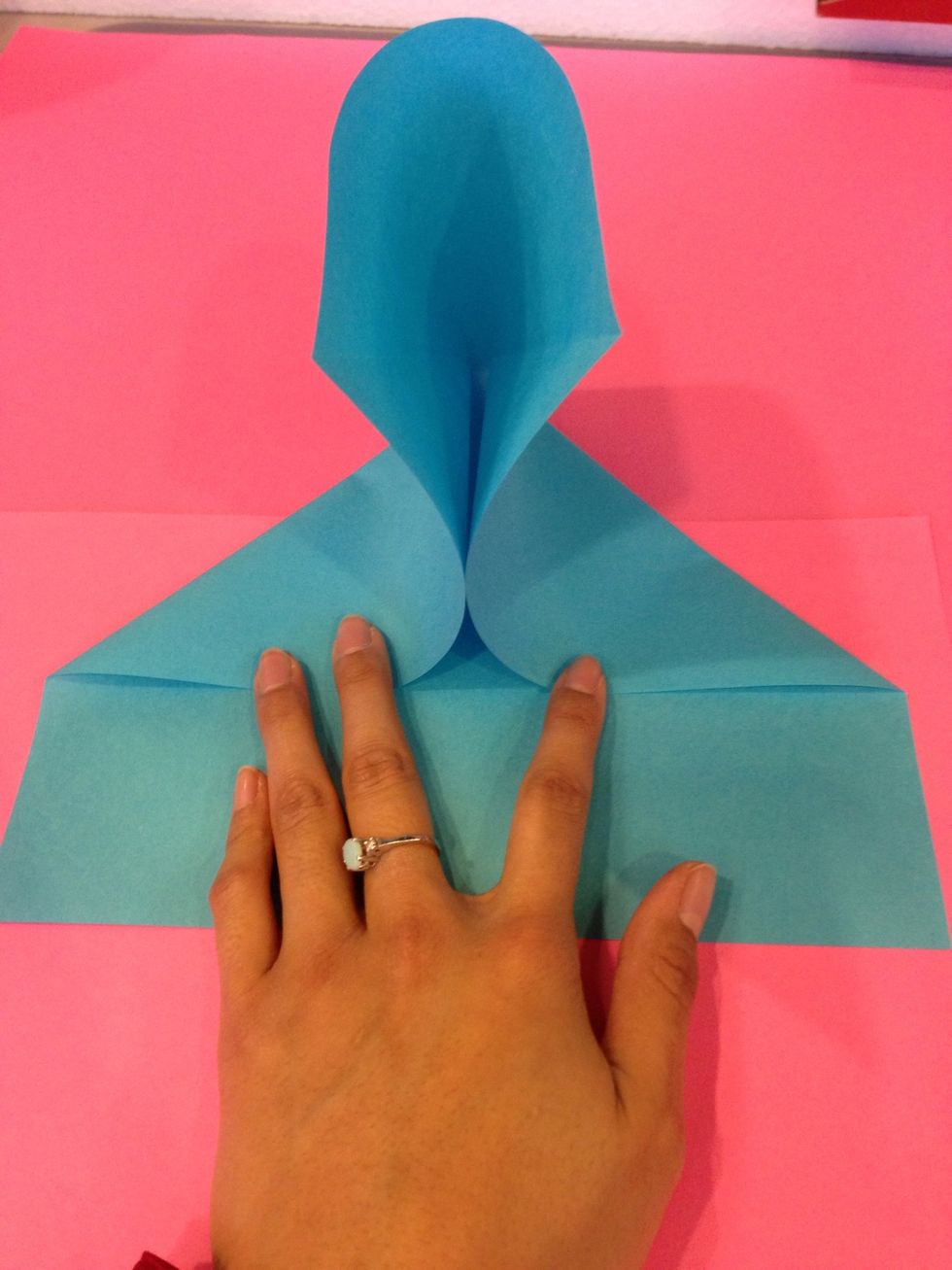 Once u have the sides down were going to create the triangle - take the top part and press it flat