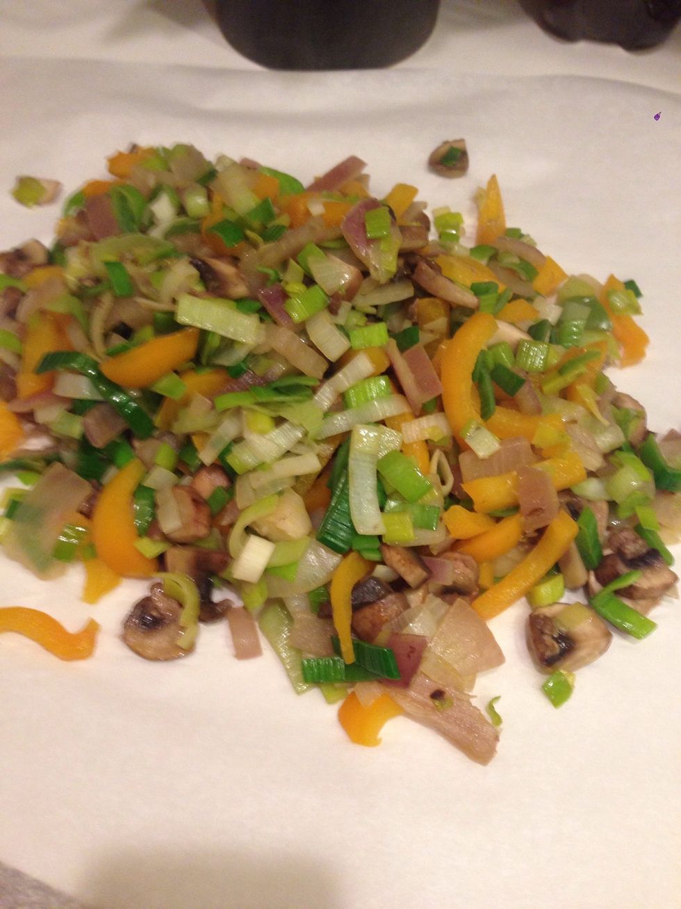 Once veggies are saut\u00e9ed, I put them on the side. I just put them on some wax paper.