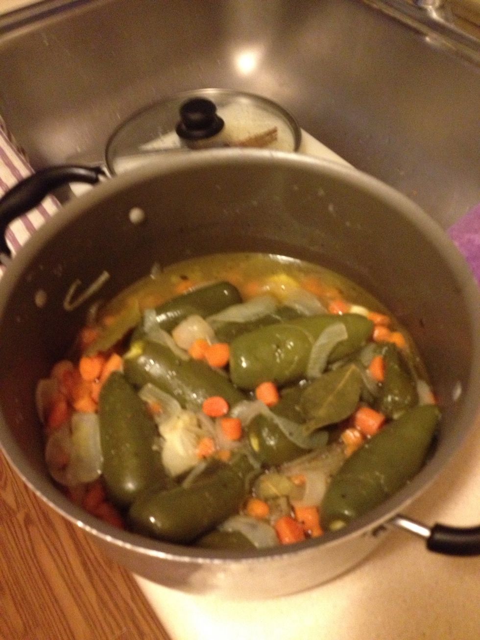 Once vinegar comes to a boil and all ingredients are soft, cover with a lid  for about 15 mins. You would add the pigs feet now and allow to sit covered for 2-3 hours.