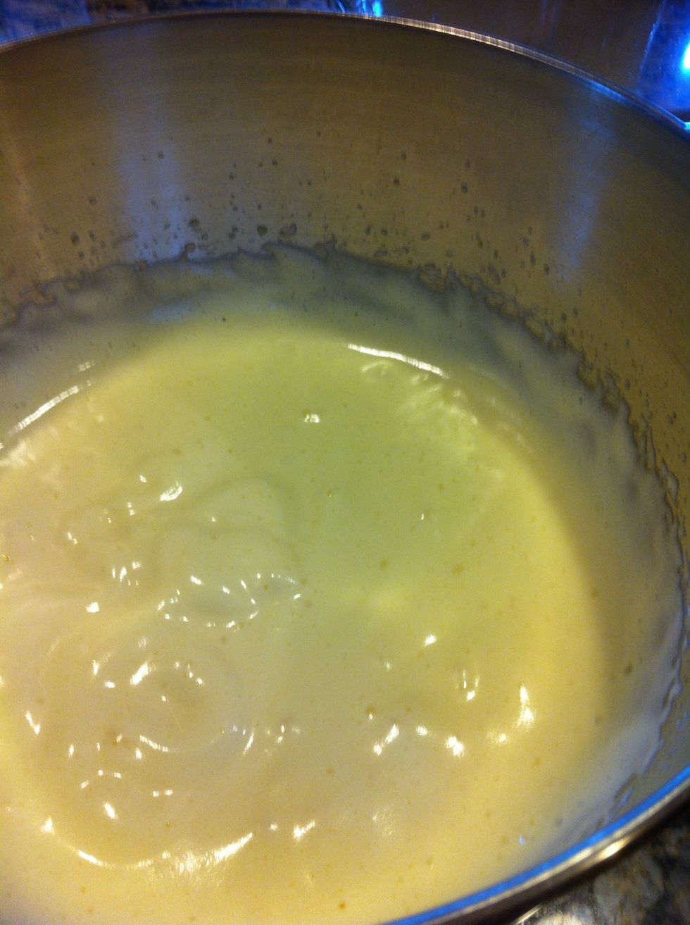 Once warmed, pour into mixer and beat until pale and fluffy