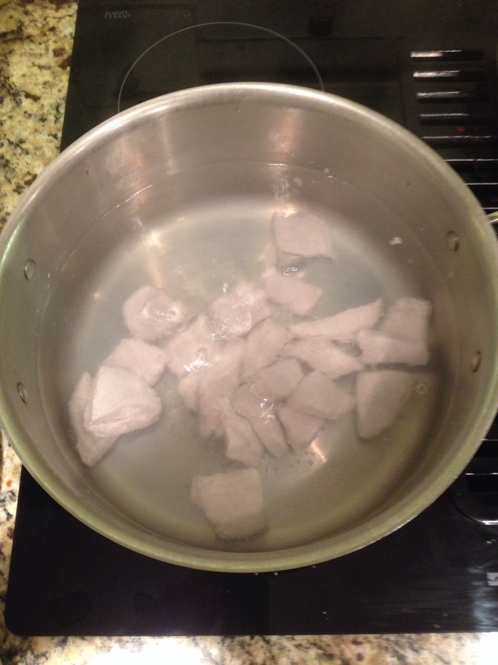 Once water is boiling, add pork.