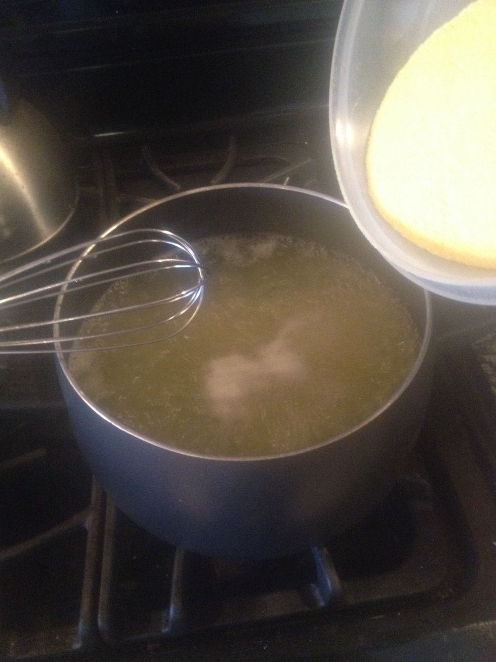 Once water is boiling, lower the temperate and VERY slowly add cornmeal and constantly whisk to avoid lumps