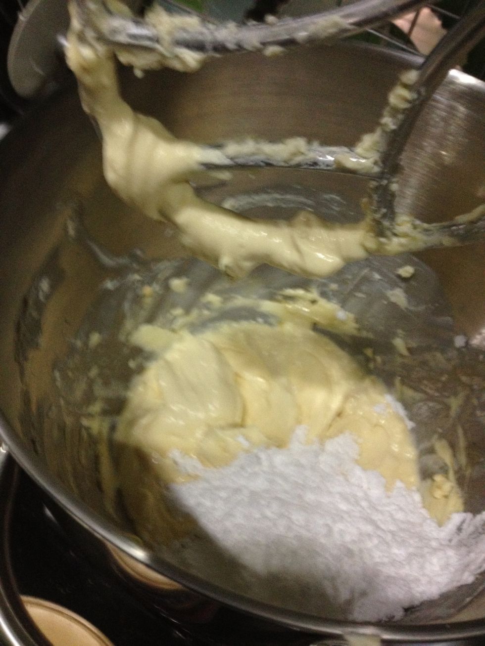 Once well creamed, add in sugar. I used icing sugar because I had no fine sugar... I only had course sugar. Mix.