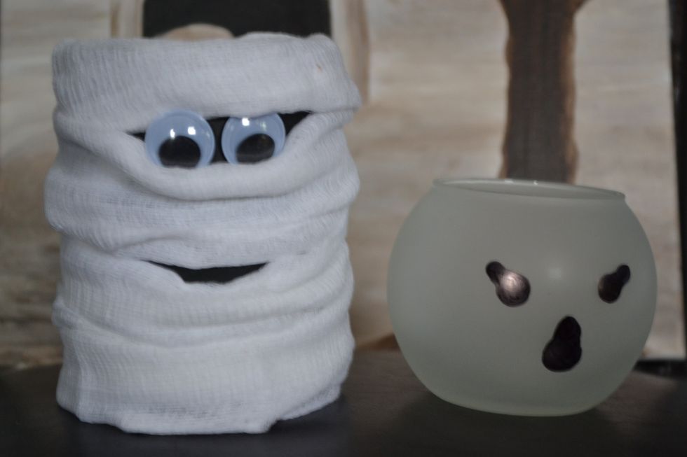 Once wrapped, take your large googly eyes and separate the cheesecloth slightly to insert. If you are having trouble getting them to stay use a small glue dot on the back of each eye.