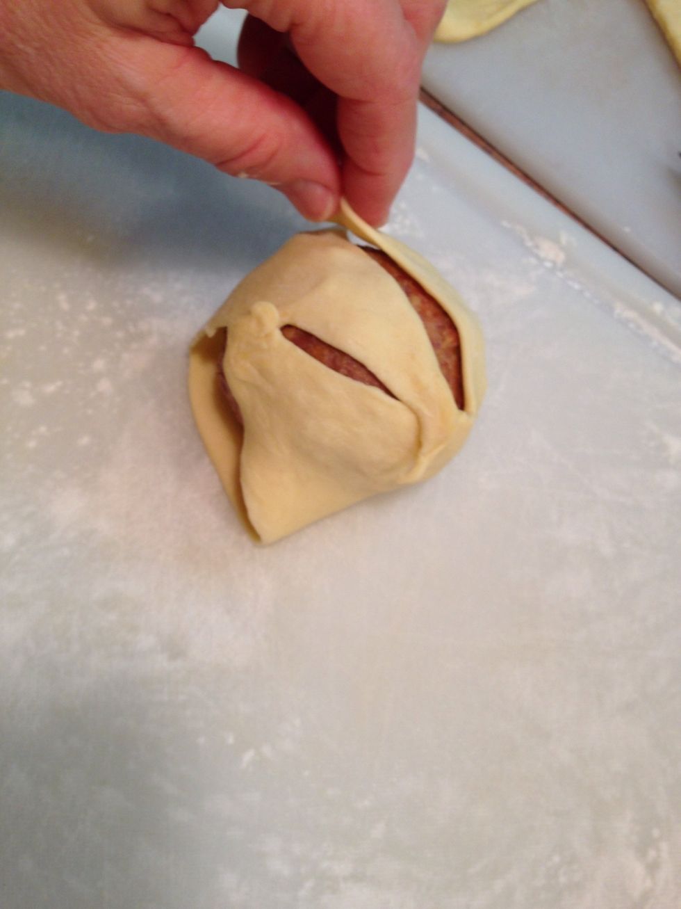 Once wrapped, you can stretch to cover meat/egg ball entirely...