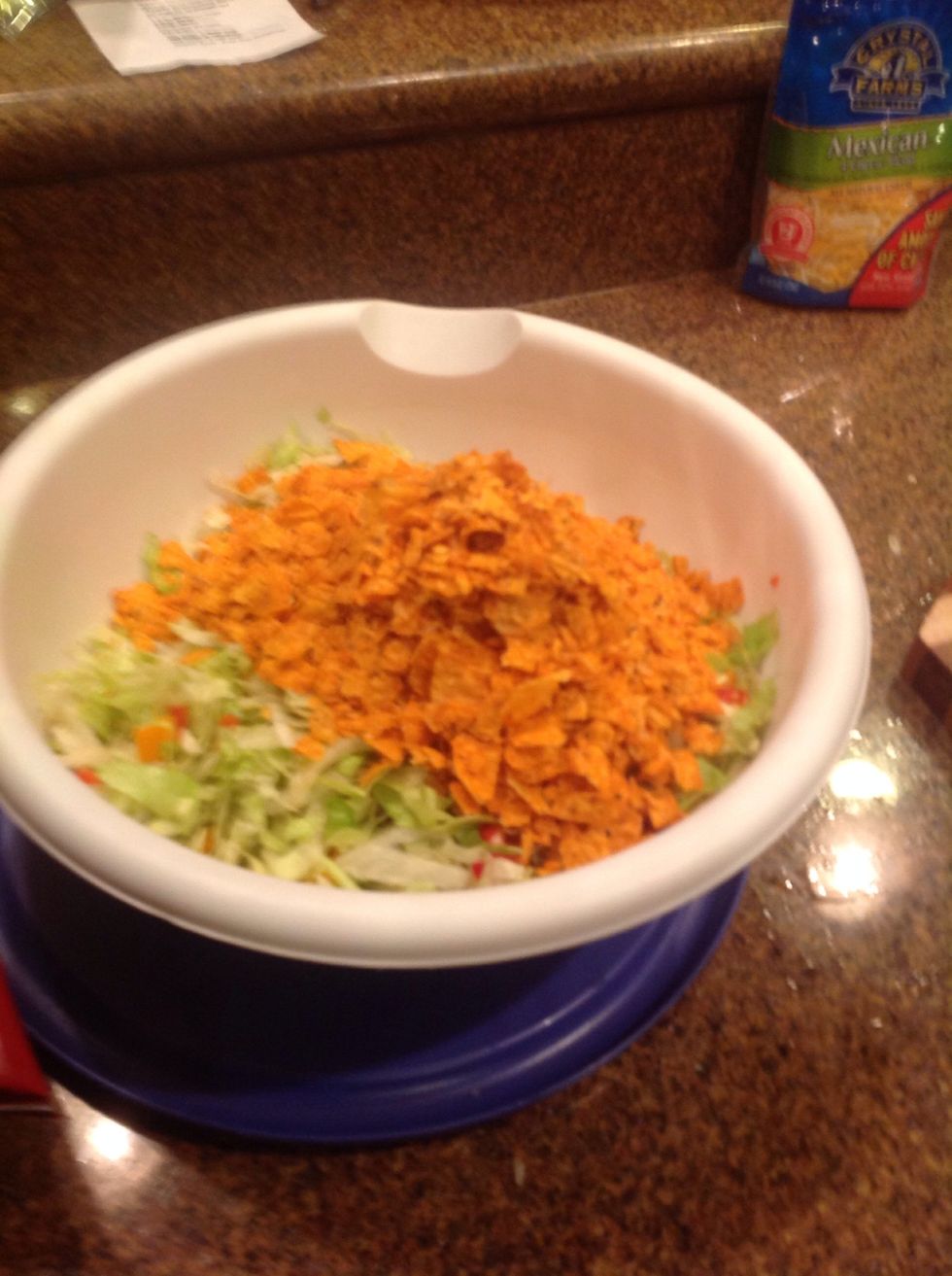 Once you are done crushing the Doritos, place into the bowl and mix it up agin.