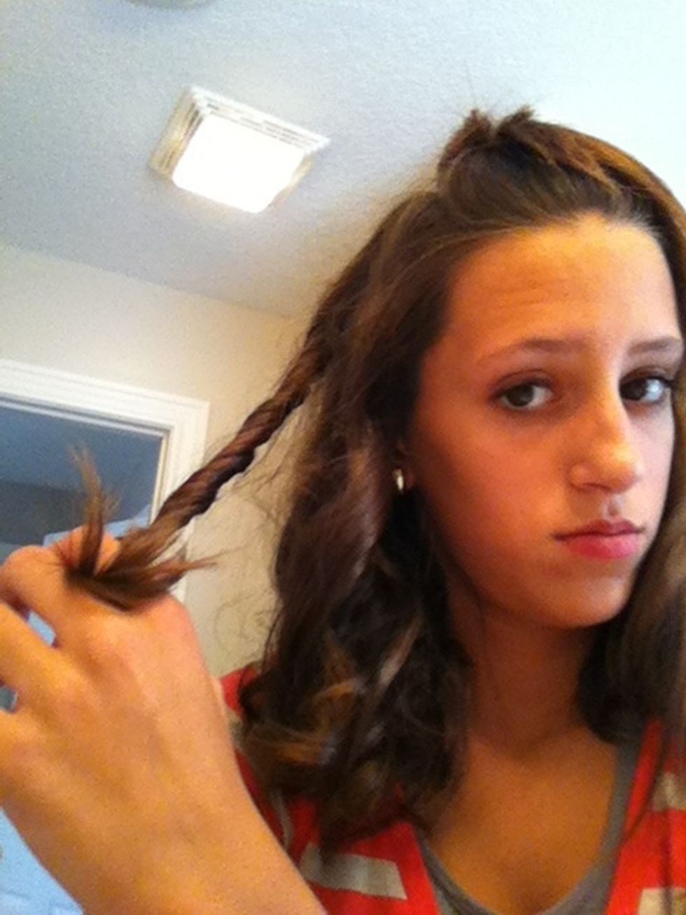 Once you are done curling a piece of your hair.. Twist it to have a better and tighter curl