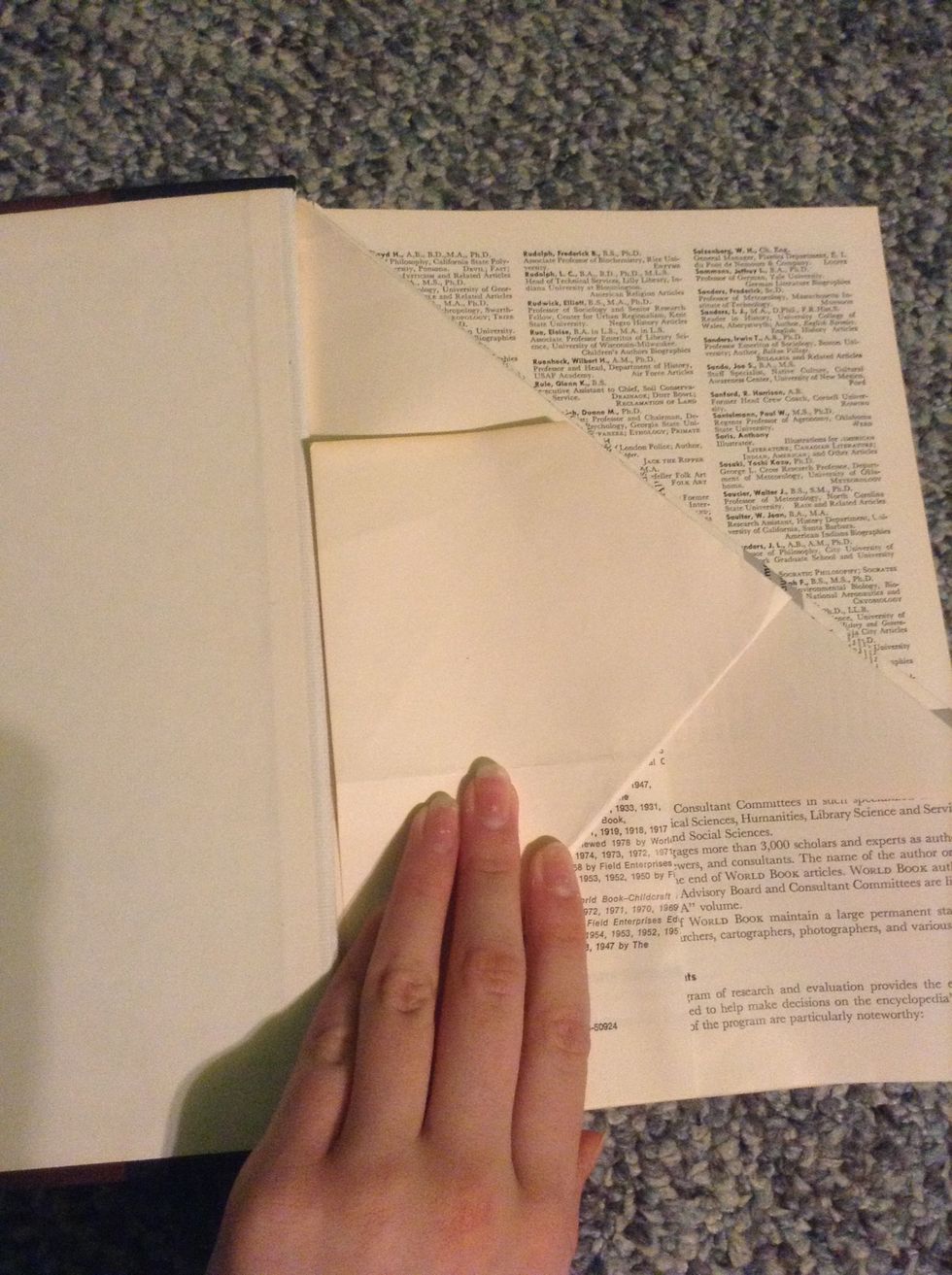 Once you are done folding the book one way, go back to the beginning and fold bottom right to middle. (Tired of folding yet?) :)