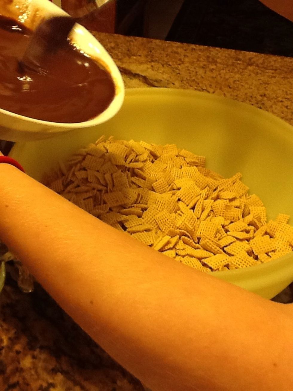 Once you are done stirring add the mixture to the bowl of Chex.