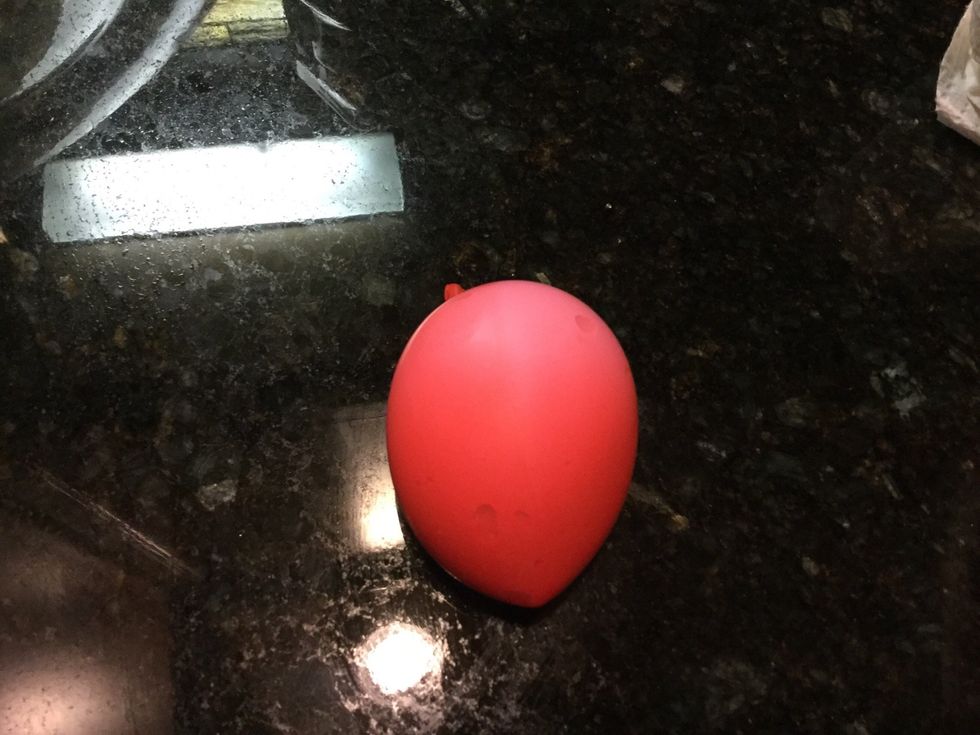 Once you are done take the funnel out of the balloon and tie your balloon.