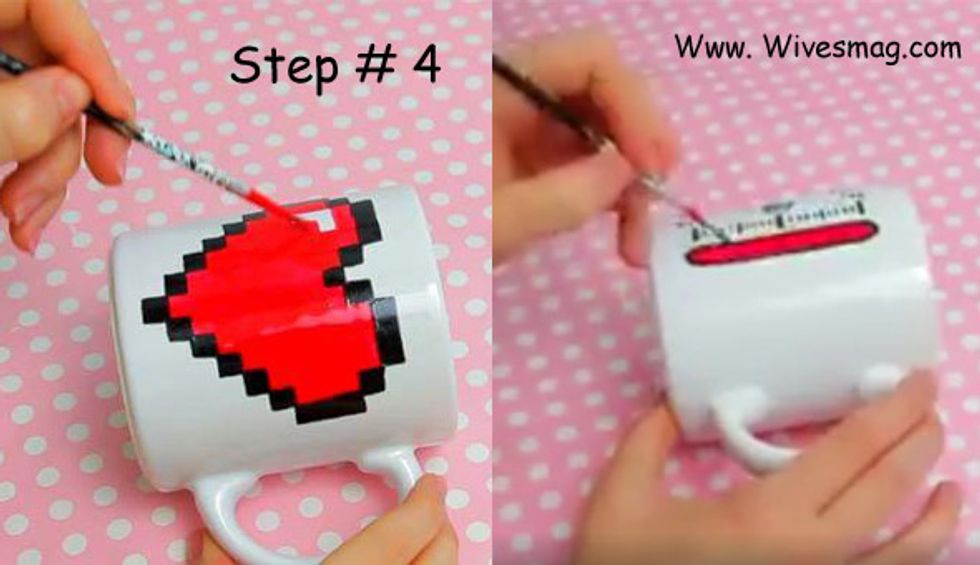 Once you are done with drawing and shading the black outlines, grab some porcelain paint. You can buy it from any craft shop. Take some red porcelain paint and fill the heart using this color.