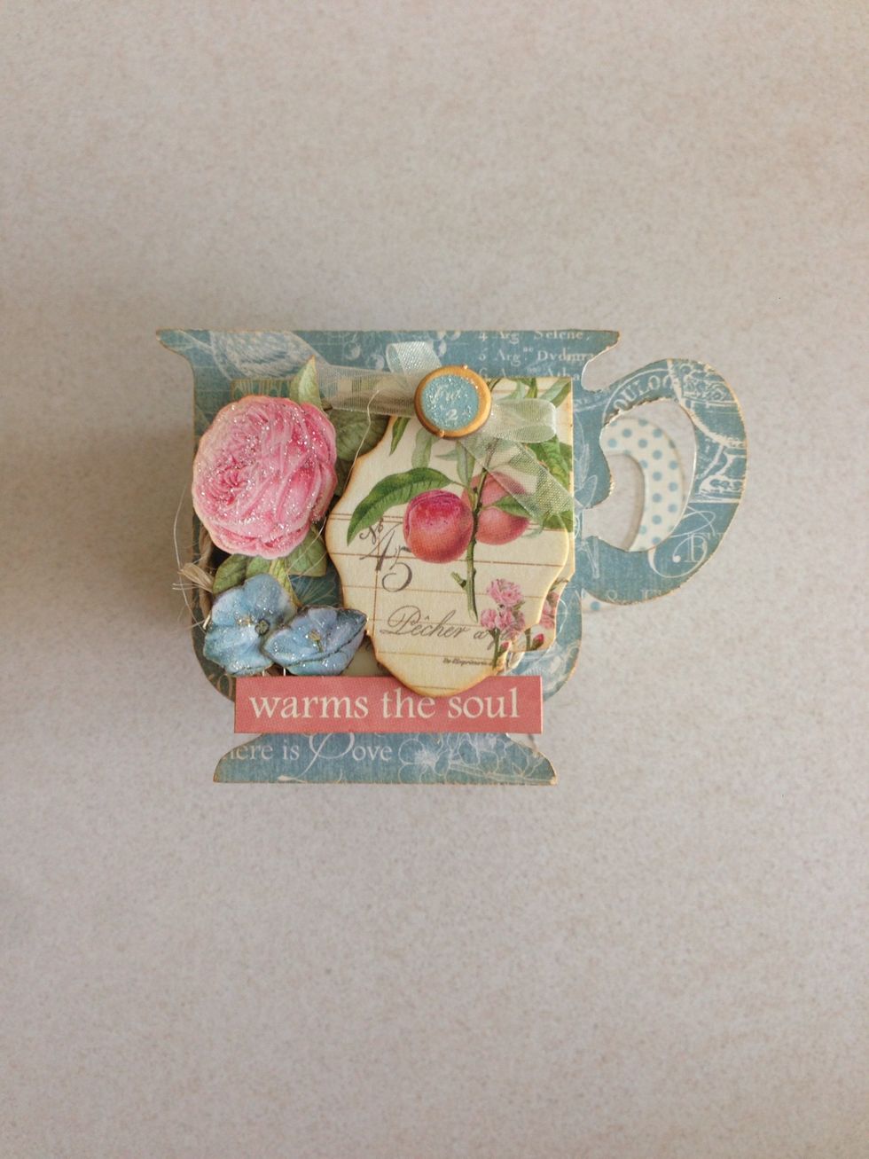 Once you are done, you can embellish your new teacup container using some twines, ribbons and other botanical tea chipboards and banners...