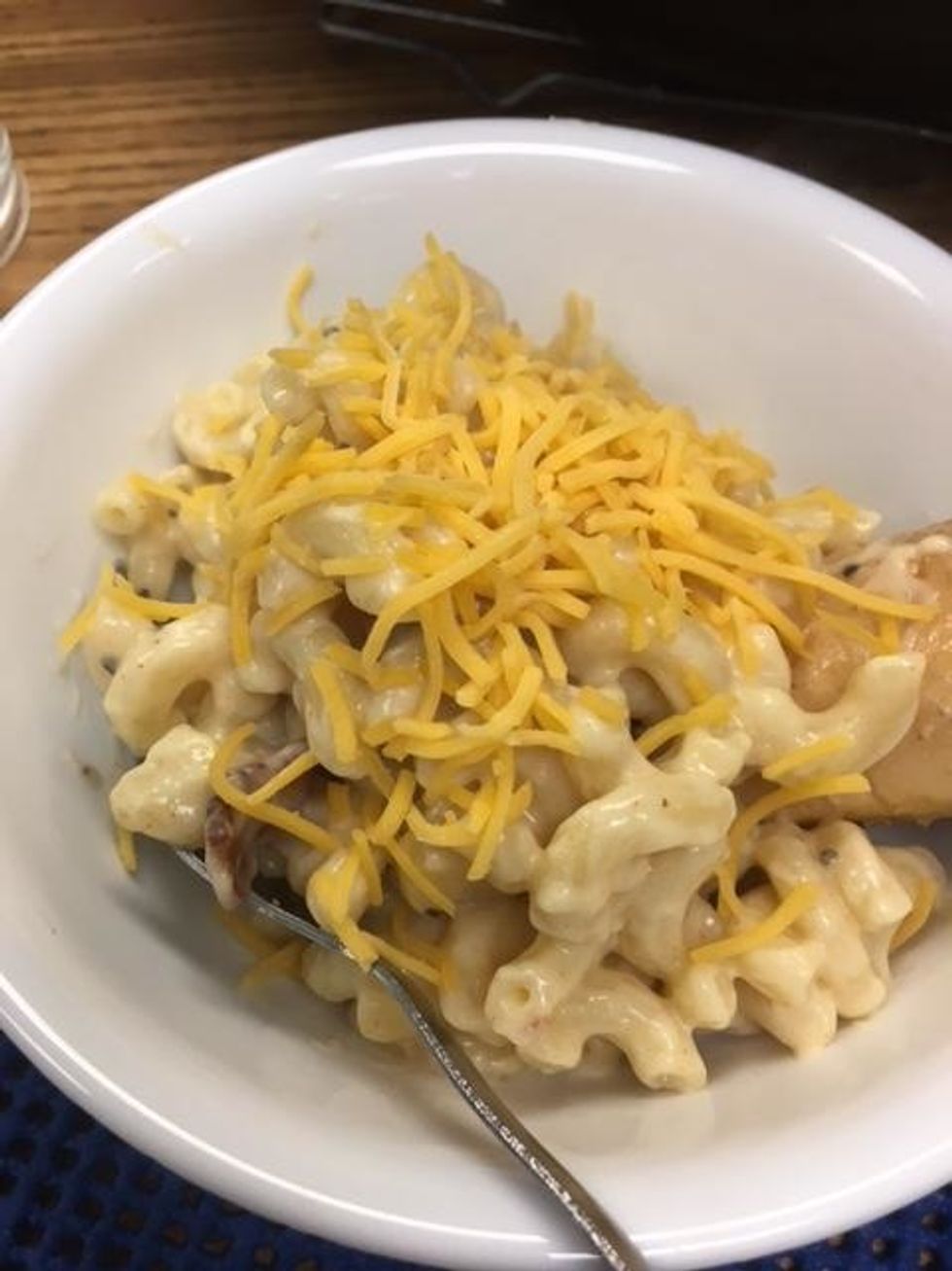 Once you are finished sprinkle cheddar cheese over the top and serve.